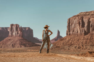 Woman standing powerfully with her hand on her hip in Monument Valley, Utah
