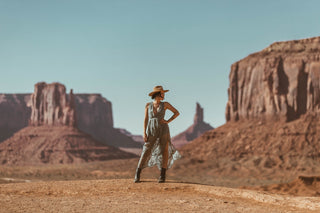 Woman standing powerfully with her hand on her hip in Monument Valley, Utah