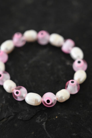 pink evil eye white pearl bracelet