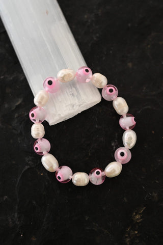 pink evil eye white pearl bracelet