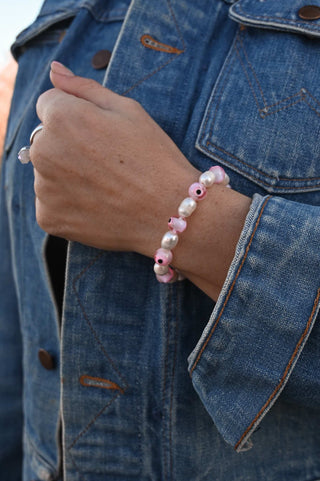 pink evil eye white pearl bracelet