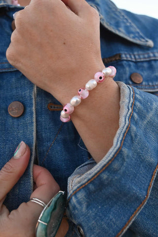 pink evil eye white pearl bracelet