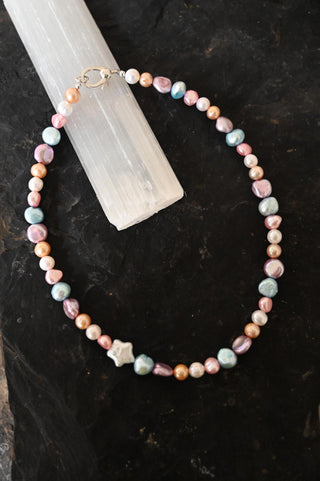 multi colored pearl necklace with white pearl star