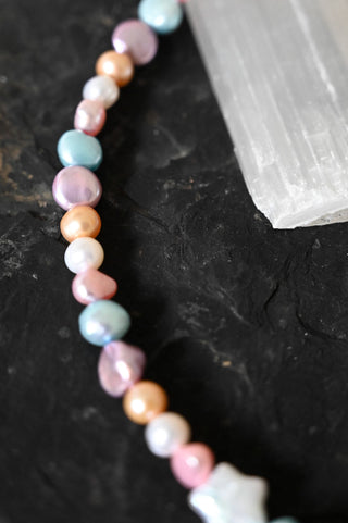 multi colored pearl necklace with white pearl star