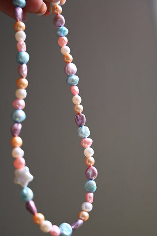 multi colored pearl necklace with white pearl star