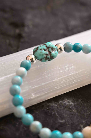 blue gemstone bracelet with charm